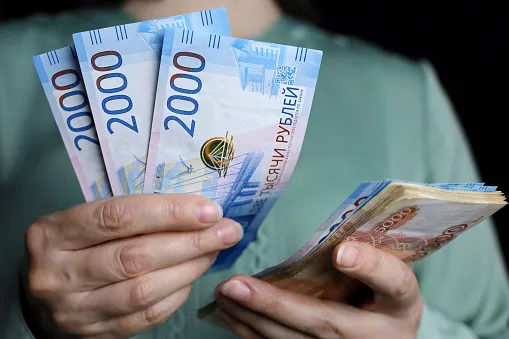 russian rubles in female hands cash pay salary inflation or savings concept