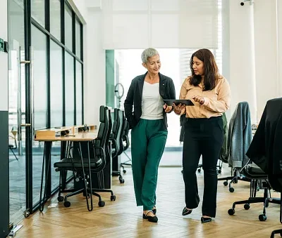 women of different ethnicities work together in modern office