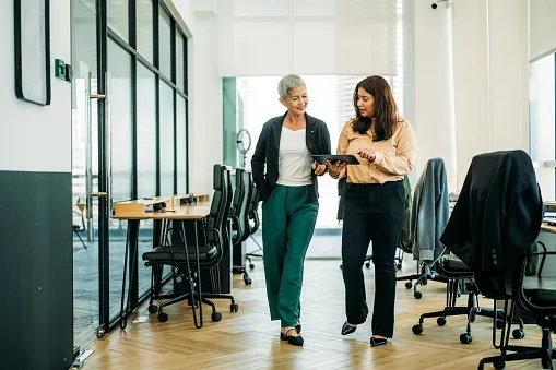 women of different ethnicities work together in modern office